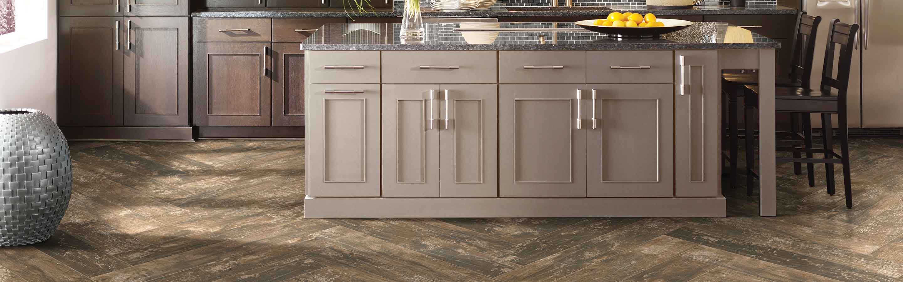 Wood look tile in kitchen with island. 