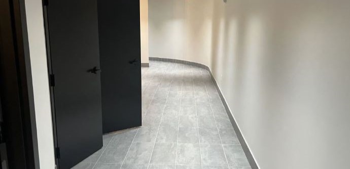Commercial Installation- gray tile flooring in bathroom